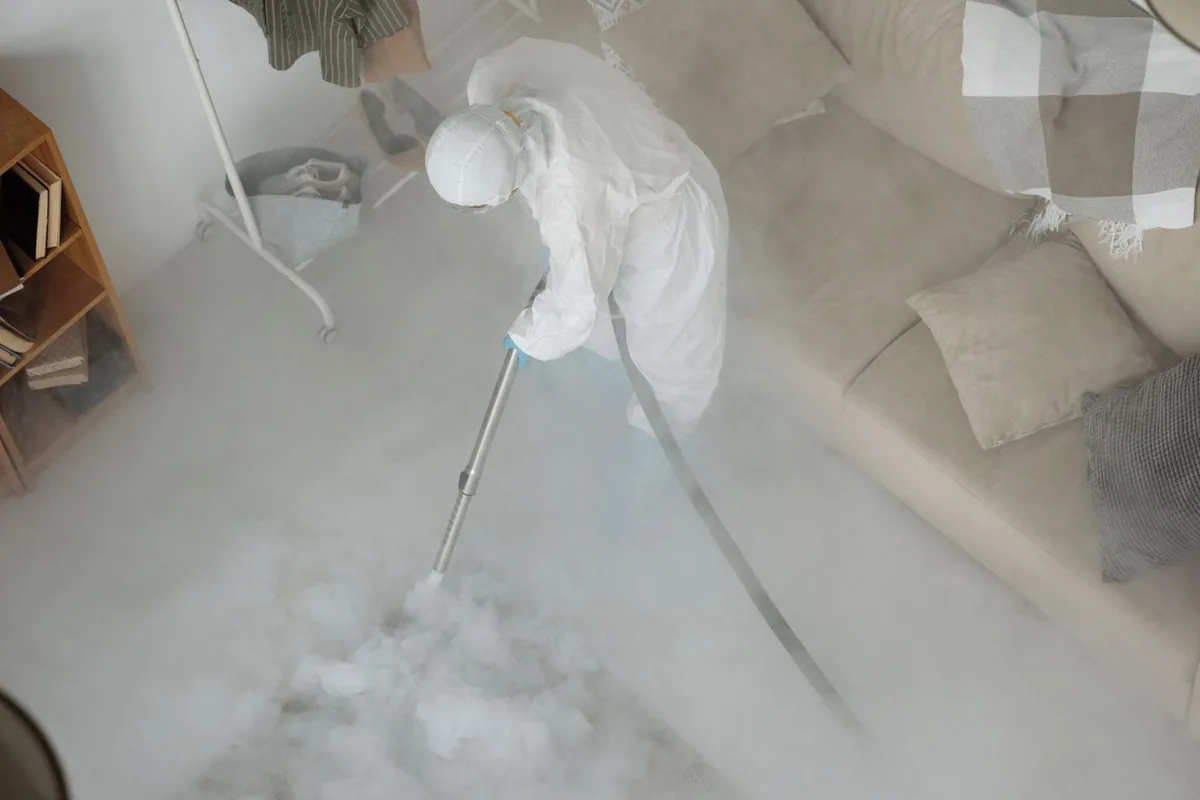 Biohazard cleanup technician in protective equipment, Peabody, MA